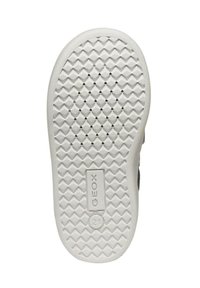 Suela de goma blanca con patrón de diamantes texturizado, que presenta orificios de ventilación y logotipo en relieve, diseñada para la transpirabilidad.