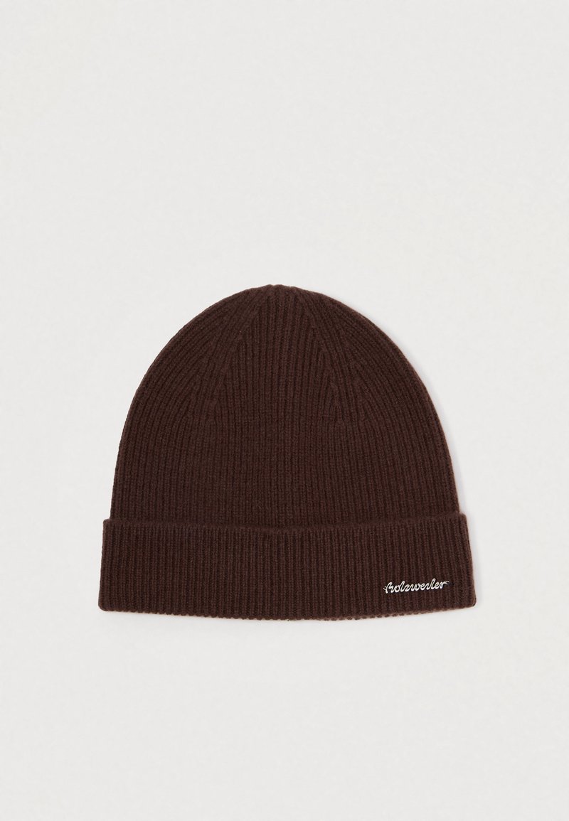 Brown knit beanie with a folded cuff and ribbed texture. Features a small embroidered logo on the cuff. Made from soft material.