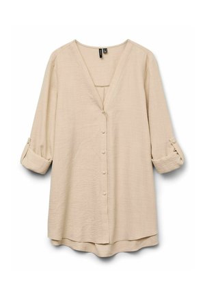Blouse beige à boutons avec un col en V, des manches longues retroussées et une coupe décontractée. Fabriquée en tissu léger et texturé.