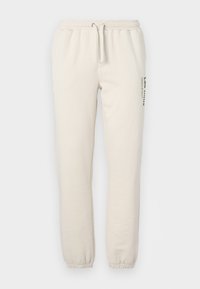 BRODY  - Tracksuit bottoms - ivory/vintage green