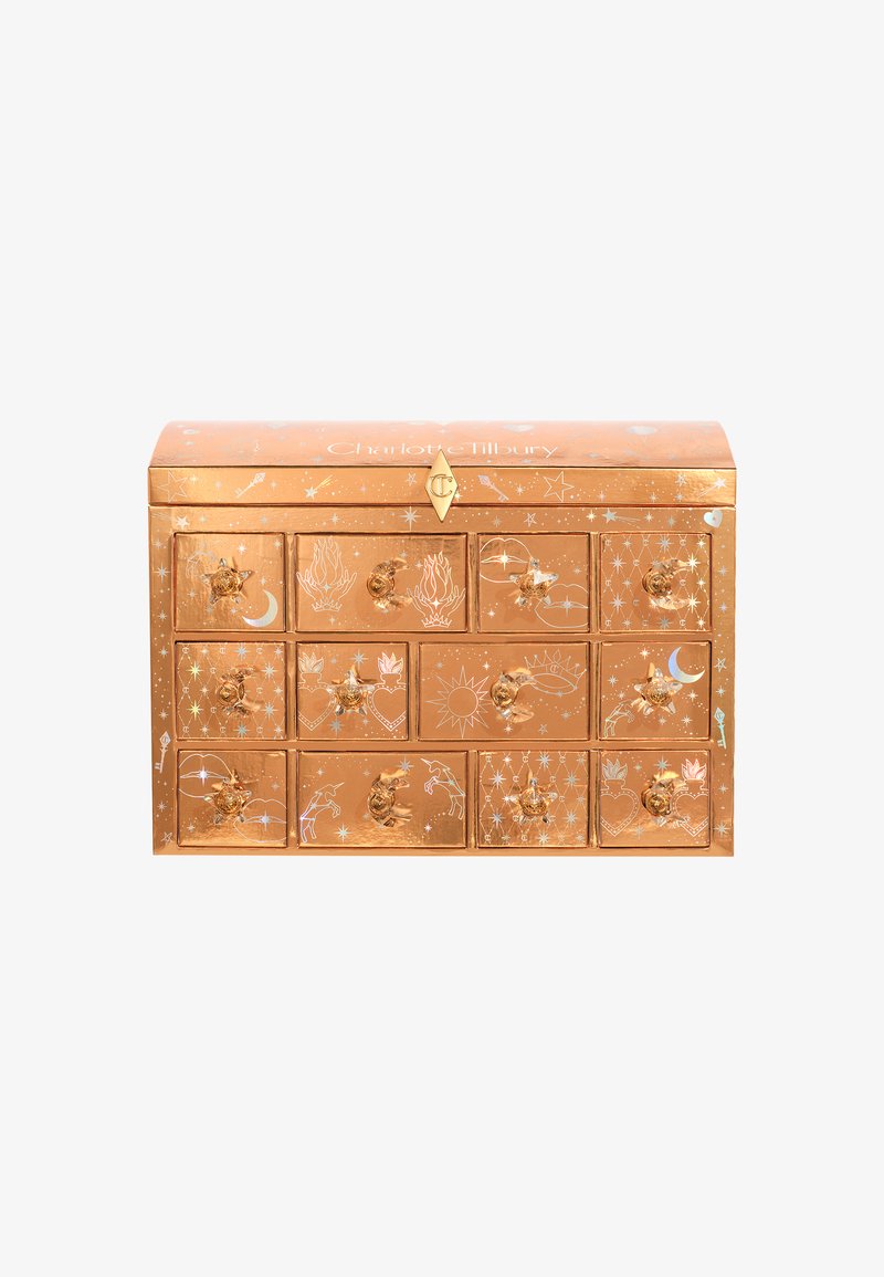 Copper-toned advent calendar with gold accents, featuring intricate celestial designs and ten drawers, each with decorative handles.
