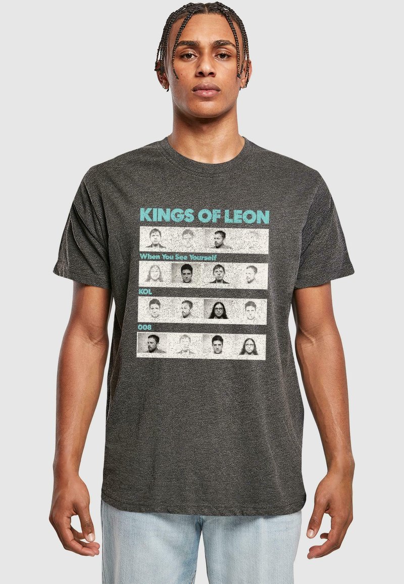 Black heather T-shirt featuring the text "KINGS OF LEON" and "When You See Yourself" above a grid of monochrome portraits.