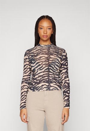 Long-sleeve turtleneck top in a sheer material featuring a black and beige zebra pattern, with a fitted design and round neckline.