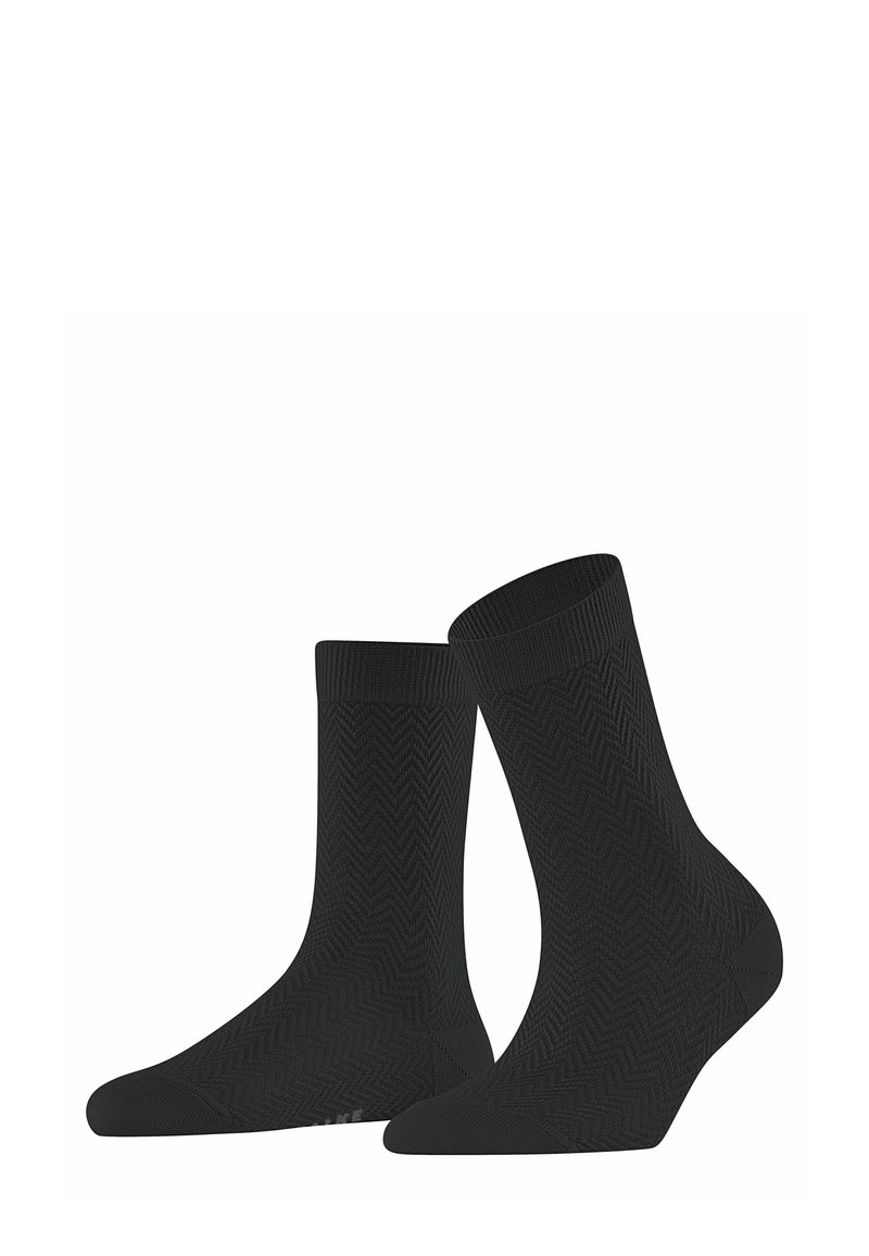 Czarne skarpetki z teksturowanym wzorem w jodełkę. Długość do połowy łydki, z wzmocnionym palcem i ściągaczem, wykonane z elastycznego, oddychającego materiału.