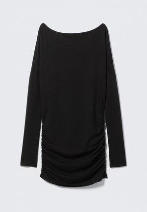 Top nero a maniche lunghe con scollo a spalle scoperte e dettaglio arricciato sul lato. Realizzato in tessuto morbido, presenta una silhouette affusolata.