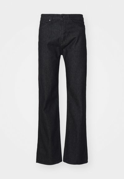 Mustad teksad sirge sääre disainiga, sisaldavad klassikalist viit taskut ja peeneid õmblus detaile. Ilma nähtava brändita.