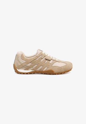 Beige casual sneaker with suede and mesh panels, lace-up closure, textured rubber sole, and side logo tag on a white background.