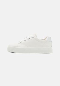 White leather sneaker with a smooth finish, rounded toe, flat white sole, silver heel accent, and six lace eyelets. Logo embossed on the side.