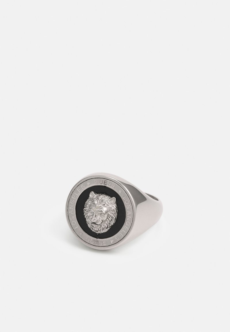 Men's silver-tone ring featuring a lion's head in relief on a black background, with engraved text around the edge. Smooth band design.
