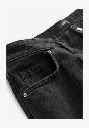 Zwarte denim jeans met een standaard tailleband, voorzak en metalen sluiting. Gelaagd stof met zichtbare stiksel-details.