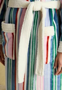 Striped bathrobe in multi-color fleece with soft white accents around the pockets and belt. Features two front pockets and a tie closure.