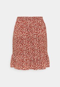 Jupe rouge à fleurs avec un ourlet volanté, une taille élastique et de petits motifs de fleurs blanches sur un fond plus sombre. Tissu léger.