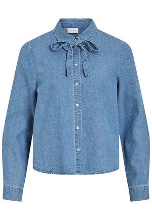 Chemise en denim bleu clair à manches longues avec des boutons-pression argentés sur le devant et un nœud noué au col.