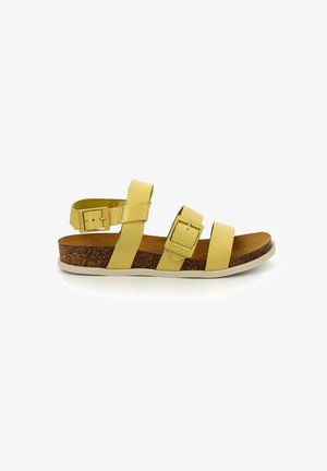 Sandal in pelle gialla con due cinturini regolabili, soletta in sughero e suola in gomma bianca. Presenta una fibbia per una vestibilità sicura.