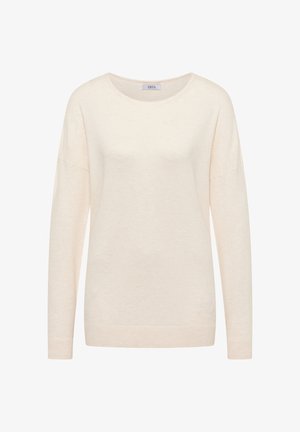 Pull léger beige à manches longues, avec un col rond, coupe décontractée et texture douce. L'étiquette indique "CECIL". Design simple, sans motifs ni accents.