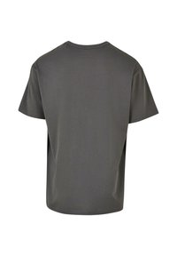 T-shirt à col rond gris foncé uni à manches courtes, vu de dos sur un fond blanc.