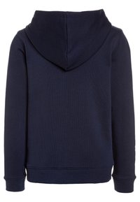 Sweat-shirt à capuche bleu marine avec une texture douce, des poignets et un ourlet côtelés, présentant une couture centrale au dos et une coupe décontractée.