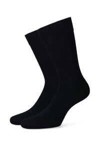 Czarne bawełniane skarpetki z zaokrąglonym końcem, o gładkiej fakturze i żebrowanych mankietach, z bezszwowym palcem i średnią grubością dla wygody.