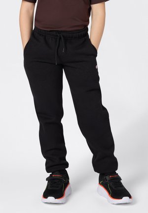 Zwarte trainingsbroek met een elastische tailleband en verstelbare koord, gemaakt van zachte stof. Het ontwerp heeft zakken en een logodetail.
