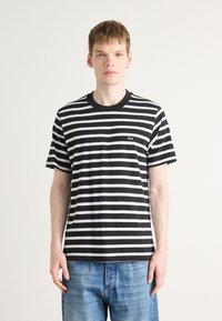 Black and white striped T-shirt with short sleeves, round neck, and an embroidered "MN" logo on the left chest. Classic casual fit.