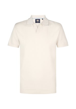 Polo cu mânecă scurtă în bej deschis, cu guler și țesătură texturată cu modele diagonale subtile.