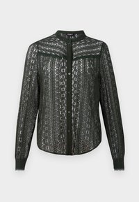 Blouse en dentelle noire à manches longues avec motifs floraux, boutonnée devant, col montant et manches avec poignets.