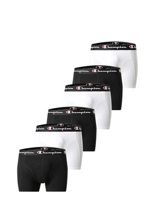 Sechs Paar schwarz-weißer Champion-Boxershorts, gestapelt in abwechselnden Farben, mit einem schwarzen Bund und dem Champion-Logo.
