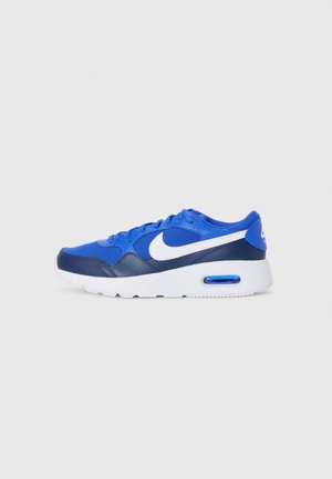 Blue athletic sneakers with a mesh and synthetic upper, featuring a white swoosh, cushioned sole, and a visible air unit in the heel.