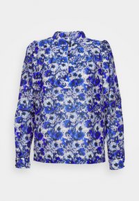 Blouse à manches longues avec motif floral abstrait bleu, blanc et noir, col montant et poignets boutonnés.