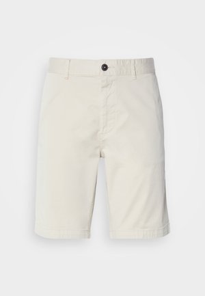Light beige shorts made from cotton, featuring a button closure, front pockets, and stitched hem. Smooth texture with a casual design.
