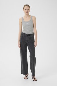 Gray tank top with a logo, paired with high-waisted black wide-leg jeans. Black strappy sandals complete the look. Clean, minimalist style.