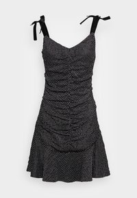 Schwarzes Kleid mit weißen Polka-Dots, gerafftem Design, verstellbaren Bindebändern, weiter Saum und glatter Textur. Kurze Länge, figurbetonte Silhouette.