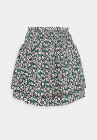 Blommönstrad kjol med smockad midja. Har små rosa, vita och turkosa blommor på en svart bakgrund. Lättviktig tyg.