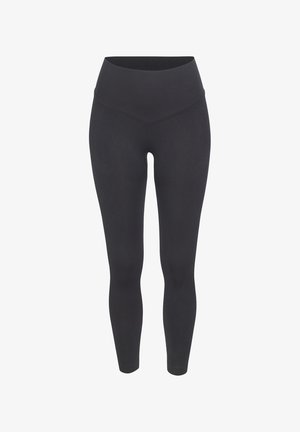 Schwarze, gerippte Leggings mit hohem Bund, die eine glatte Textur und eine körpernahe Passform für verbesserten Komfort und Flexibilität bieten.