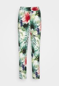 Pantalons slim avec imprimé de feuilles et fleurs tropicales dans des couleurs vert, marine, rouge et blanc.