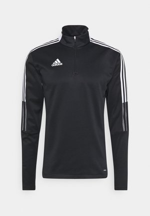 Schwarzes Adidas Langarm-Sportoberteil mit weißen drei Streifen auf Schultern und Ärmeln, halbem Reißverschluss und Adidas-Logo auf der linken Brust.