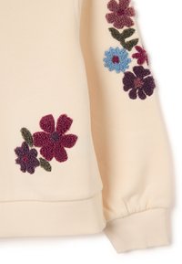 Sudadera crema con bordado floral texturizado en burdeos, azul y verde. Puños y dobladillo acanalados, tela suave con un acabado liso.