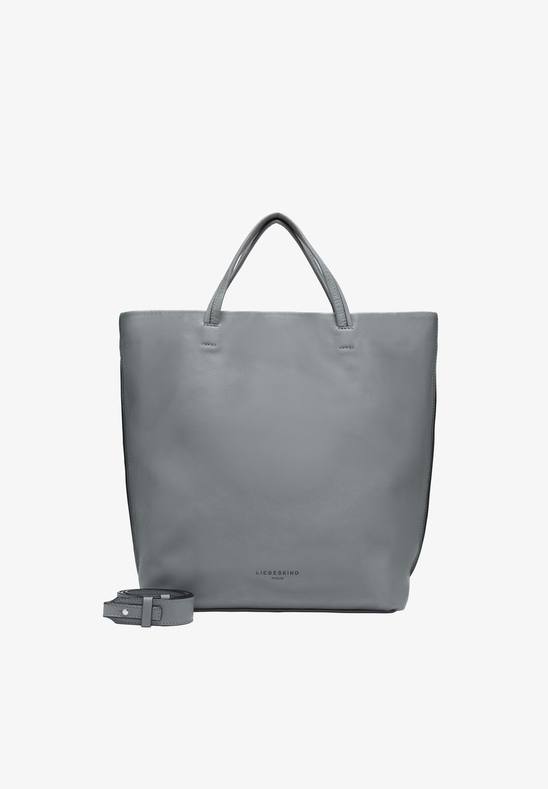 Grey leather tote bag with dual handles, minimalist design, rectangular shape, smooth texture, and removable strap. Features logo at the bottom.