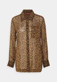 Camicia con stampa leopardata in tessuto traslucido, maniche lunghe, colletto a punta e due tasche sul petto. La palette di colori presenta toni di marrone e nero.