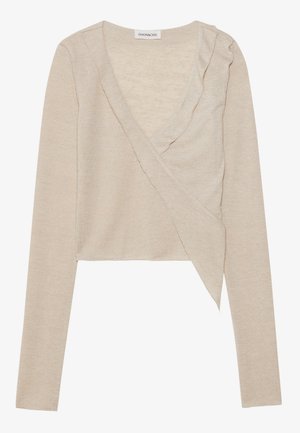 Beige Wickeloberteil mit langen Ärmeln, einem V-Ausschnitt und Rüschendetails entlang des Ausschnitts. Hergestellt aus weichem, strukturiertem Strickstoff. Kürzere Passform.