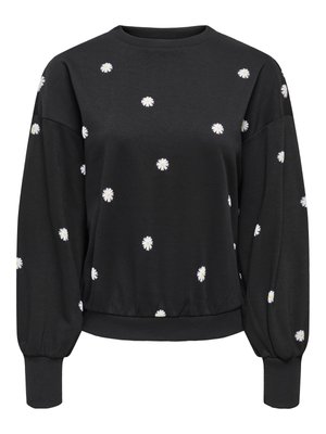 Melnā sporta džemperī ar apaļu kaklu un garām, uzpūstām piedurknēm. Izšuvumi ar baltiem margrietiņziediem sadalīti pa visu džemperi. Mīksts, teksturēts audums ar piegulošu apmali.