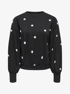 Melnā sporta džemperī ar apaļu kaklu un garām, uzpūstām piedurknēm. Izšuvumi ar baltiem margrietiņziediem sadalīti pa visu džemperi. Mīksts, teksturēts audums ar piegulošu apmali.