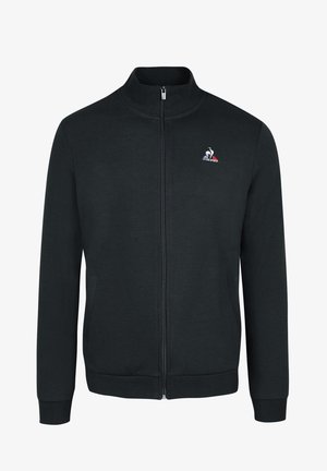 Felpa nera con zip e colletto alto, realizzata in tessuto morbido. Presenta tasche laterali e un logo ricamato sul petto.