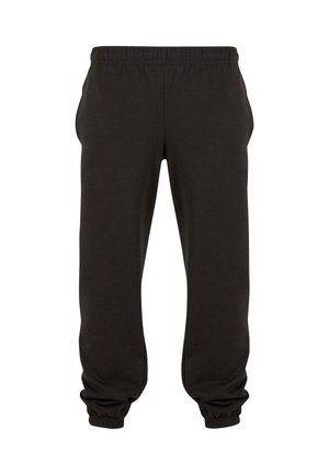 Pantalon de jogging noir à taille élastique avec chevilles bordées et poches latérales, présenté sur fond blanc.