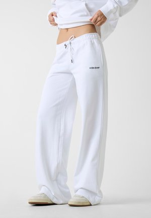 Pantaloni sportivi - weiß