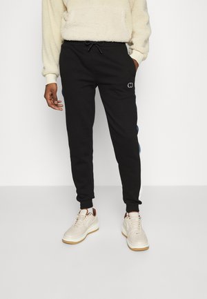 FADE JOGGER - Tracksuit bottoms - black/multi