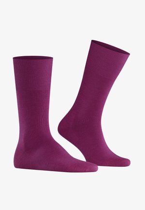 Meias de algodão com mistura de roxo, com um topo canelado e textura suave. Comprimento até a metade da panturrilha, com biqueira e calcanhar reforçados para maior durabilidade.
