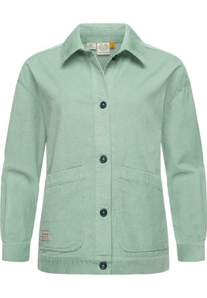 Veste en velours côtelé vert clair avec un col, fermeture à boutons, deux poches avant et des boutons foncés contrastants.