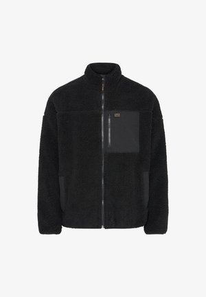 Fekete gyapjúdzseki magas gallérral, cipzáras elülső résszel és kontrasztos fekete zsebbel. Puha tapintású és laza fazonú.