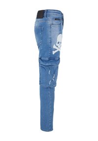 Denim cargo pants in light blue with a skull and crossbones graphic. Features distressed details, tapered leg, and multiple pockets.